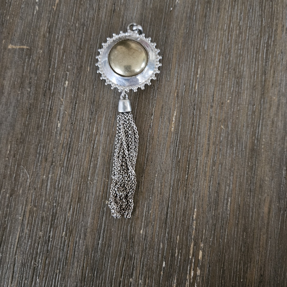 Elegant Silver Pendant with Tassel